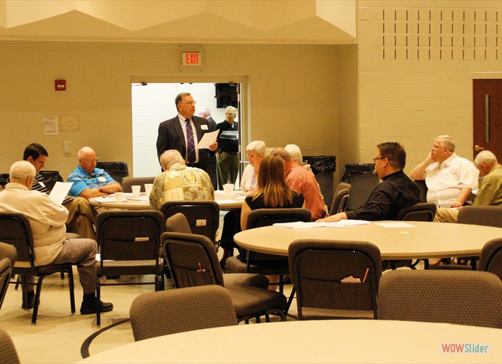 Pastor Don Allman addresses the meeting